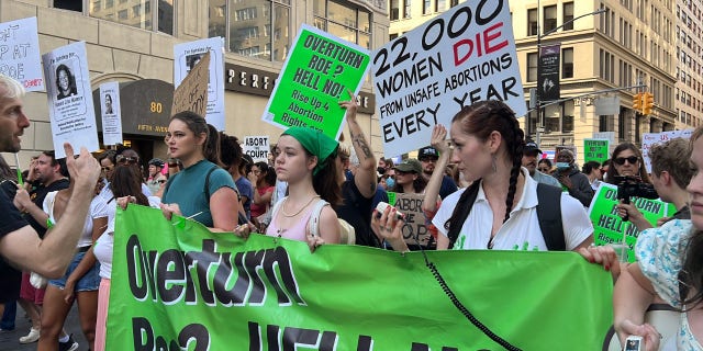 Pro-choice activists march in New York City protesting the Supreme Court's ruling to overturn Roe vs. Wade.