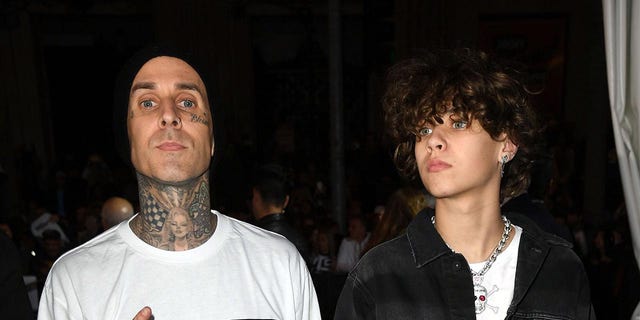 Travis Barker and Landon Asher Barker attend the premiere of Sony Pictures' "Jumanji: The Next Level" en hollywood, California.
