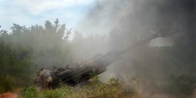Ukrainian soldiers fire at Russian positions from a U.S.-supplied M777 howitzer in Ukraine's eastern Donetsk region June 18, 2022.