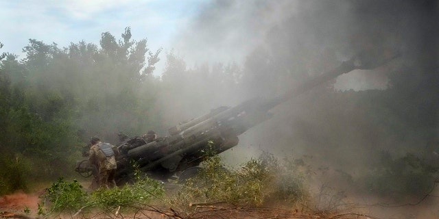 Ukrainian soldiers fire at Russian positions from a U.S.-supplied M777 howitzer in Ukraine's eastern Donetsk region June 18, 2022.