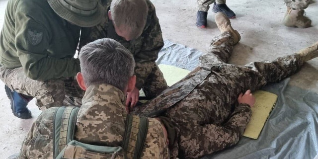 A US Army veteran provides combat lifesaving training to Ukrainian Territorial Defense Forces.