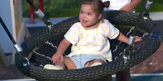 Rachel Campos-Duffy's daughter, Valentina, plays on a swing at the RWJBarnabas Field of Dreams playground in Toms River, N.J. (Fox News)