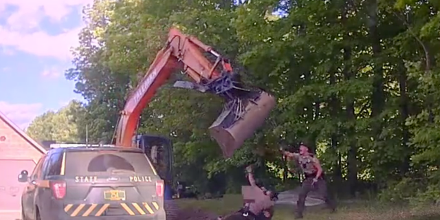 Officers could be heard on dashcam footage yelling at Wayne Tallman to turn the excavator off. 