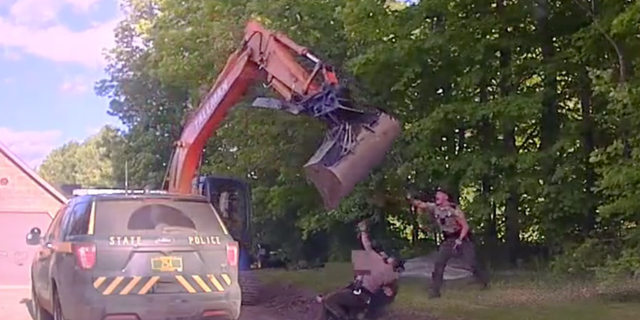 Officers could be heard on dashcam footage yelling at Wayne Tallman to turn the excavator off.