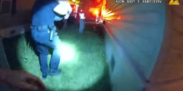 A West Allis police officer is seen running with the child in his arms toward a nearby ambulance.