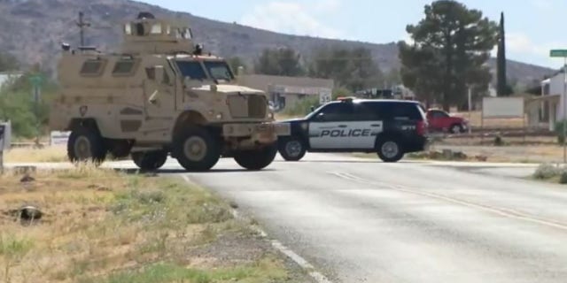 The suspect barricaded himself inside his home following the shooting.