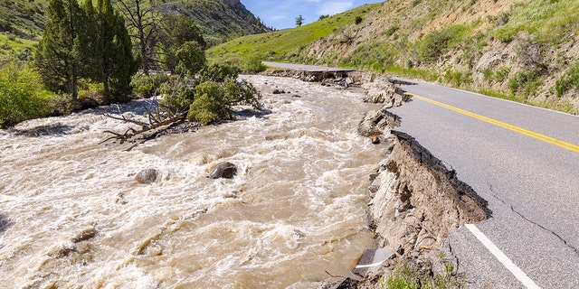 The North Entrance Road is washed out after flooding in Yellowstone National Park on June 18, in Gardiner, Montana. 
