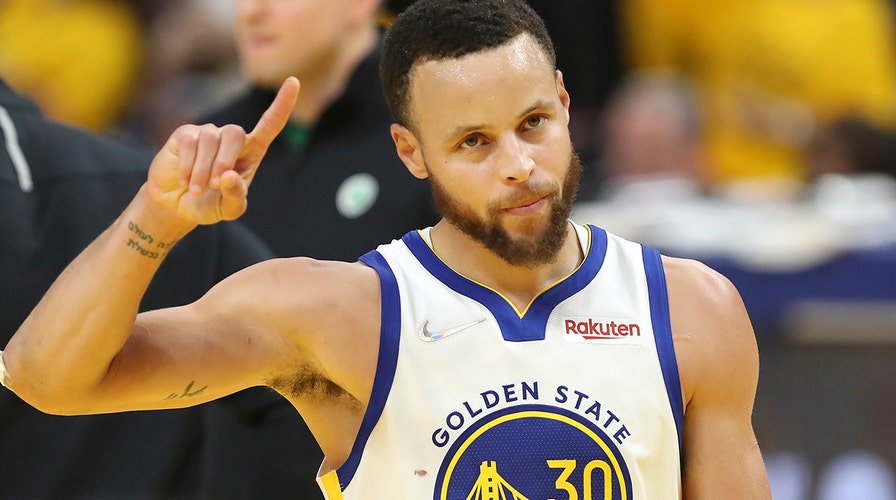 Golden State Warriors guard Stephen Curry gestures after shooting