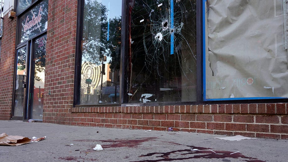 Shattered glass and blood on Philadelphia street