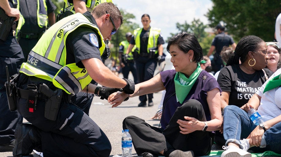 Abortion-rights activists demonstrating against the Supreme Court decision to overturn Roe v. Wade sit in an act of civil disobedience, including actress Busy Philipps, third from left in second row, Thursday, June 30, 2022, in Washington. 