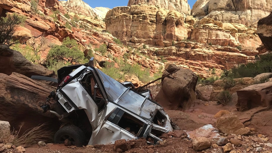 A mangled vehicle after flash flooding in Utah