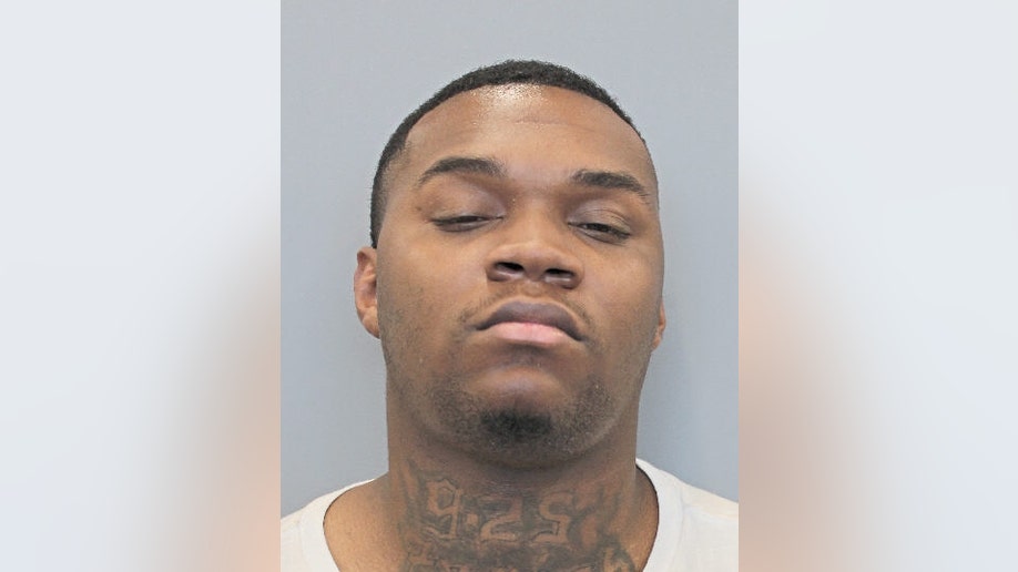 Murder suspect Jeremiah Jones, with tattoos on his neck showing