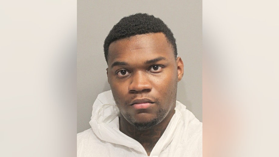 Murder suspect Jeremiah Jones in a white hoodie