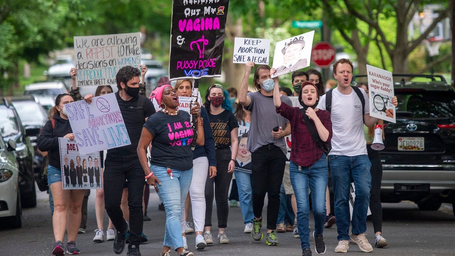 Pro-choice activists approach the home of U.S. Supreme Court Justice Brett Kavanaugh 