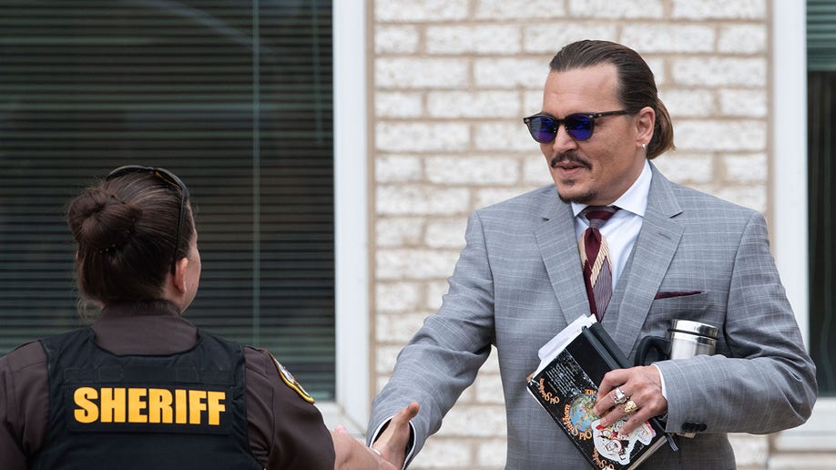 Johnny Depp shakes Fairfax County deputy's hand