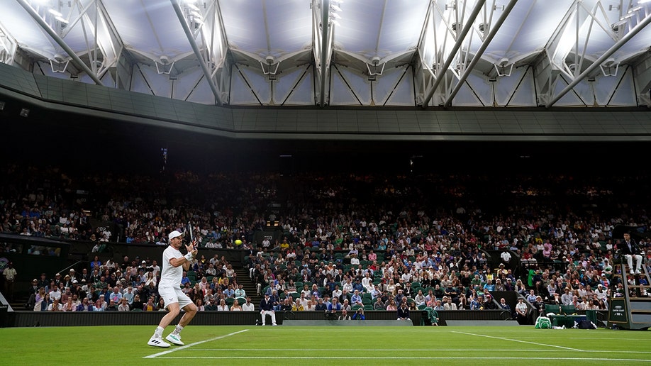 Andy Murray serves