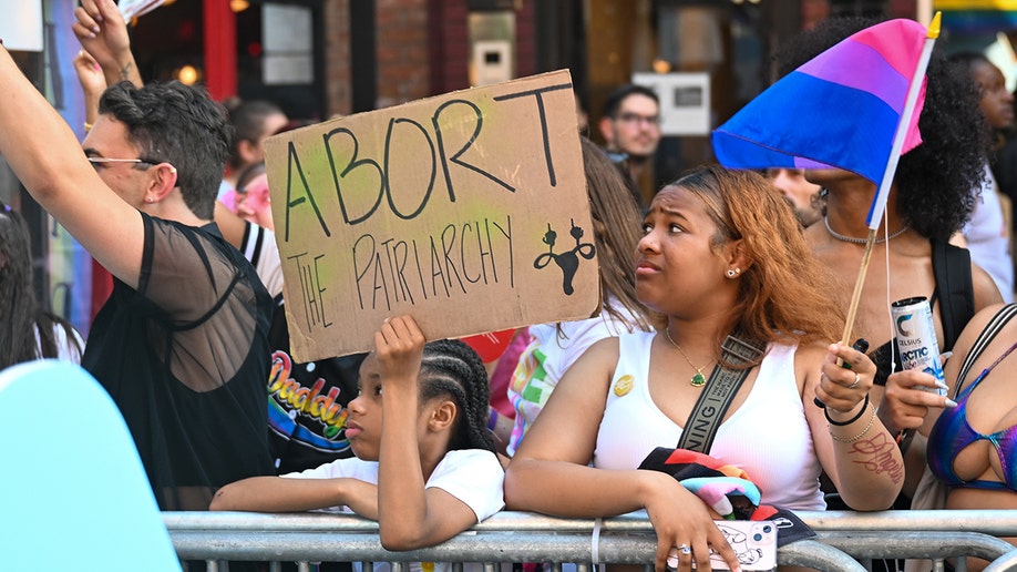 NYC Pride Parade supporters with pro-abortion sign