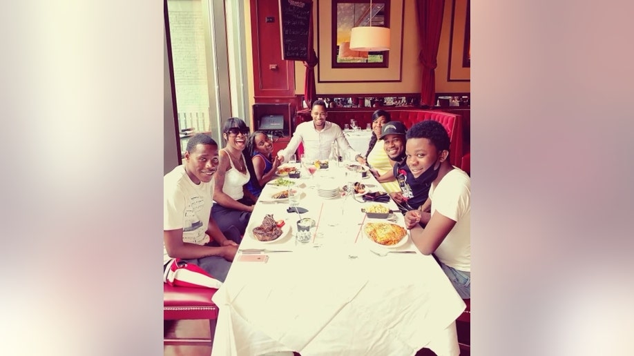 Gianno and Christian Caldwell with their family