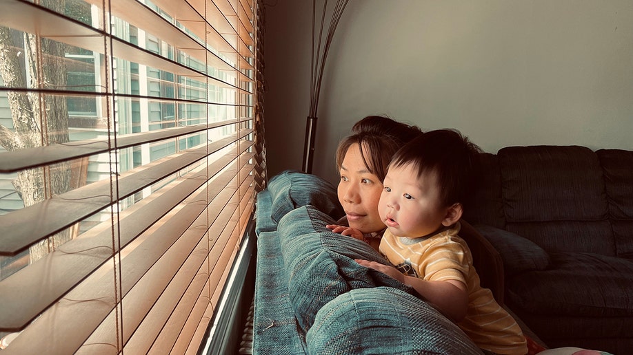 baby and mom on couch