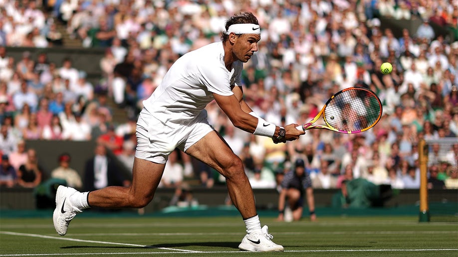 Rafael Nadal plays a backhand