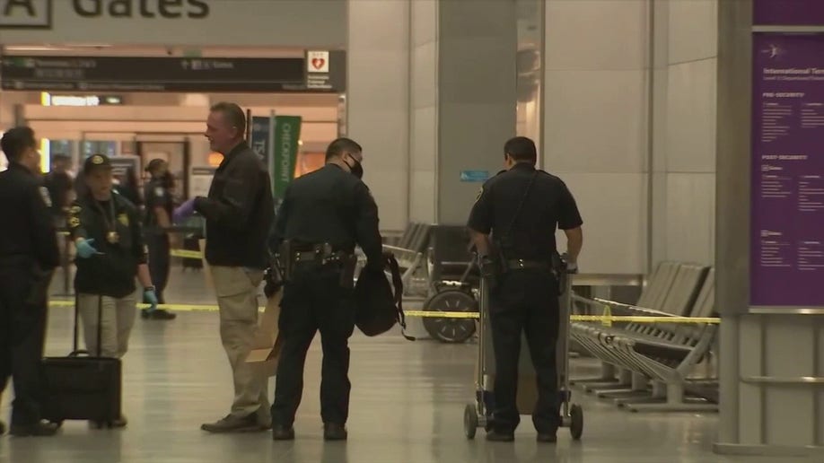 Police respond at San Francisco International Airport after a suspect was arrested in an attack that injured three on July 15.
