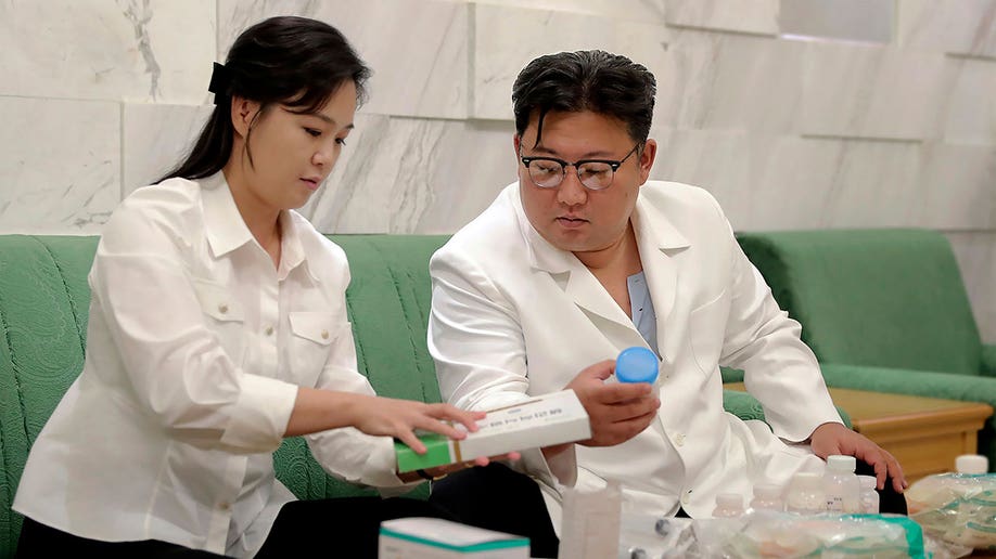 Kim Jong Un and wife