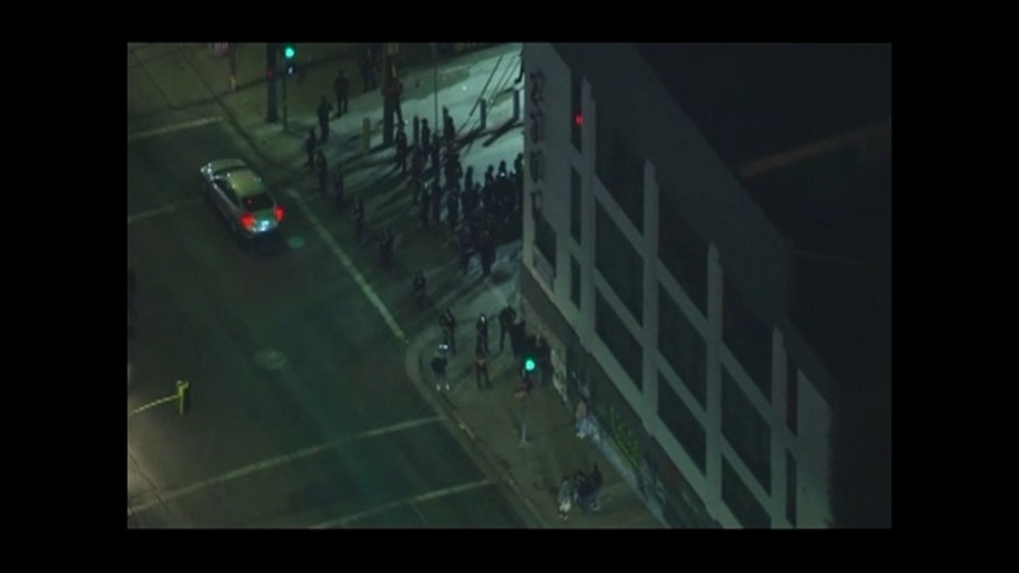 LAPD officers respond to street takeover