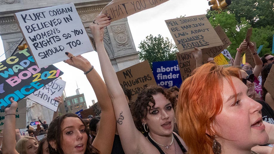 NYC protestors with signs