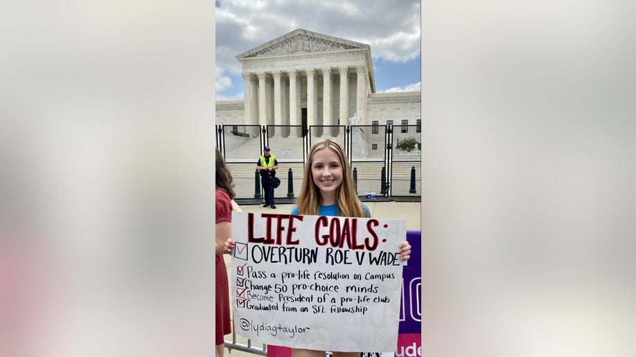 Girl holds a pro-life sign