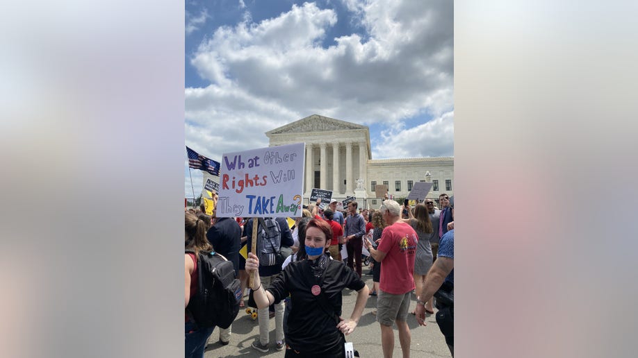 A sign reading, 'What other rights will they take away?'