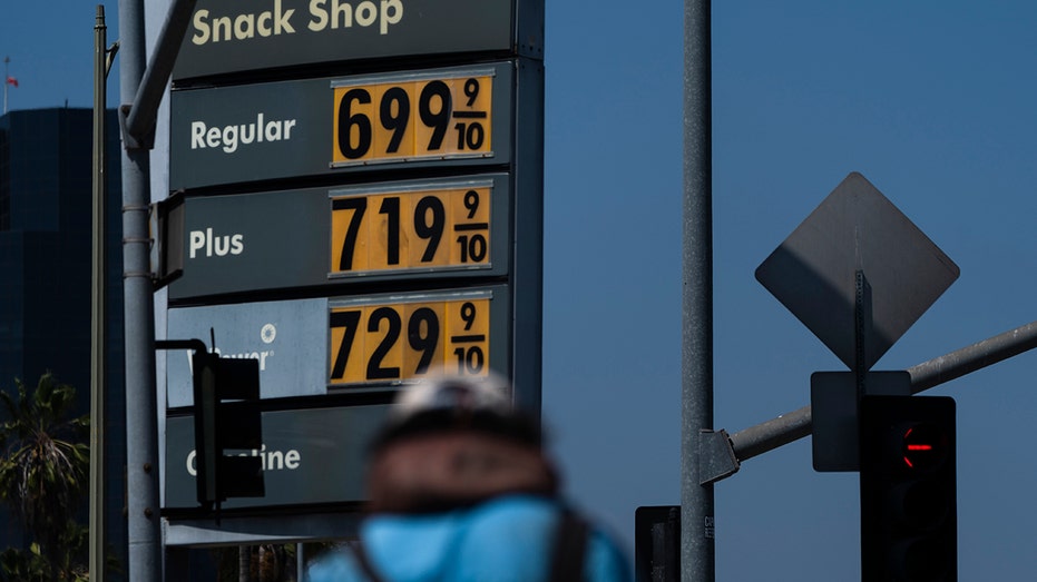Gas prices sign shows gas at nearly $7 per gallon