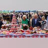 Charles and Camilla look at decorations at the Oval cricket grounds
