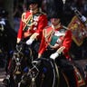 Charles and William ride horseback during Trooping