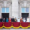 Royal family standing on balcony during parade