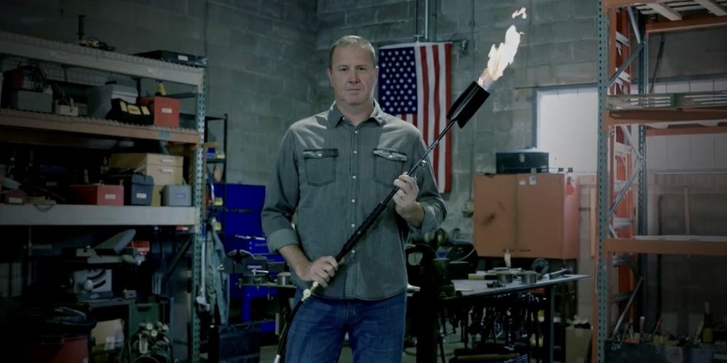 Eric-Schmitt-TV-ad-with-blow-torch.jpg?v