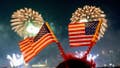 Spectators watch the 45th annual Macy&rsquo;s 4th of July Fireworks display overlooking the Manhattan skyline at Gantry State Plaza in Long Island City on July 4th, 2021 in the Queens borough of New York City.