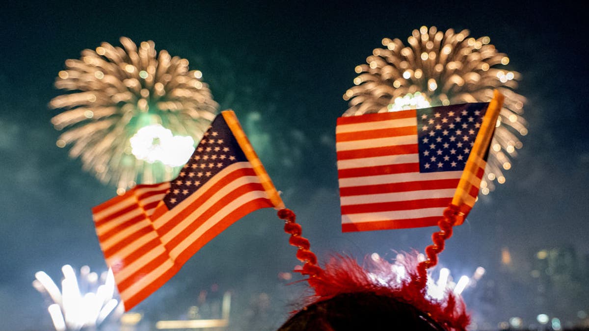 Girl watches the 4th of July fireworks