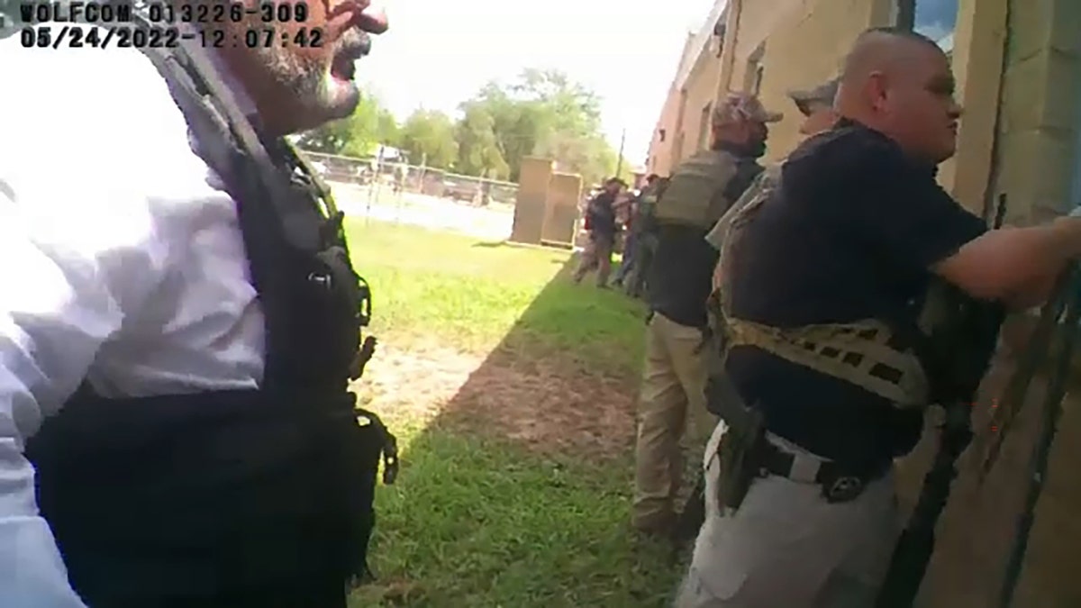 Police staging outside Robb Elementary School in Uvalde in bodycam video