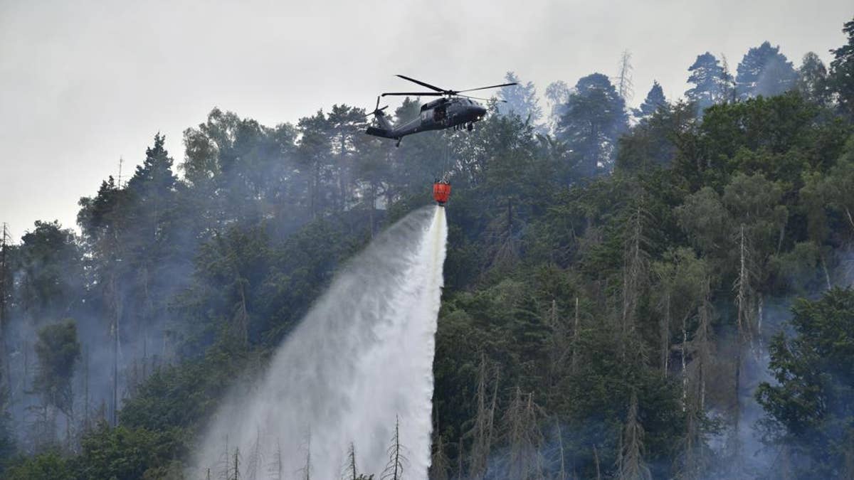 Helicopter throws water