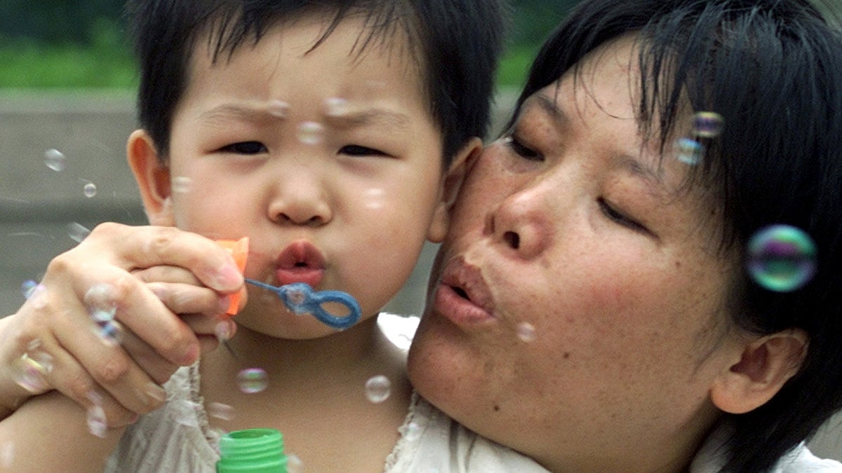 A mother and child play together in China
