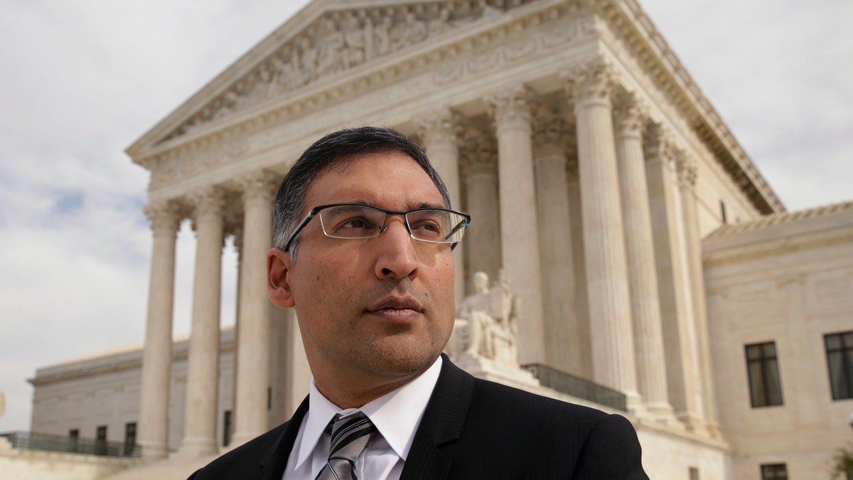 Neal Katyal gazes up on the steps of the U.S. Supreme Court in Washington DC