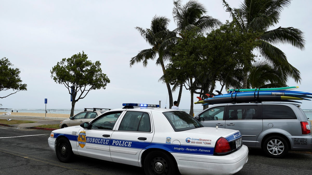 A Honolulu police car driving