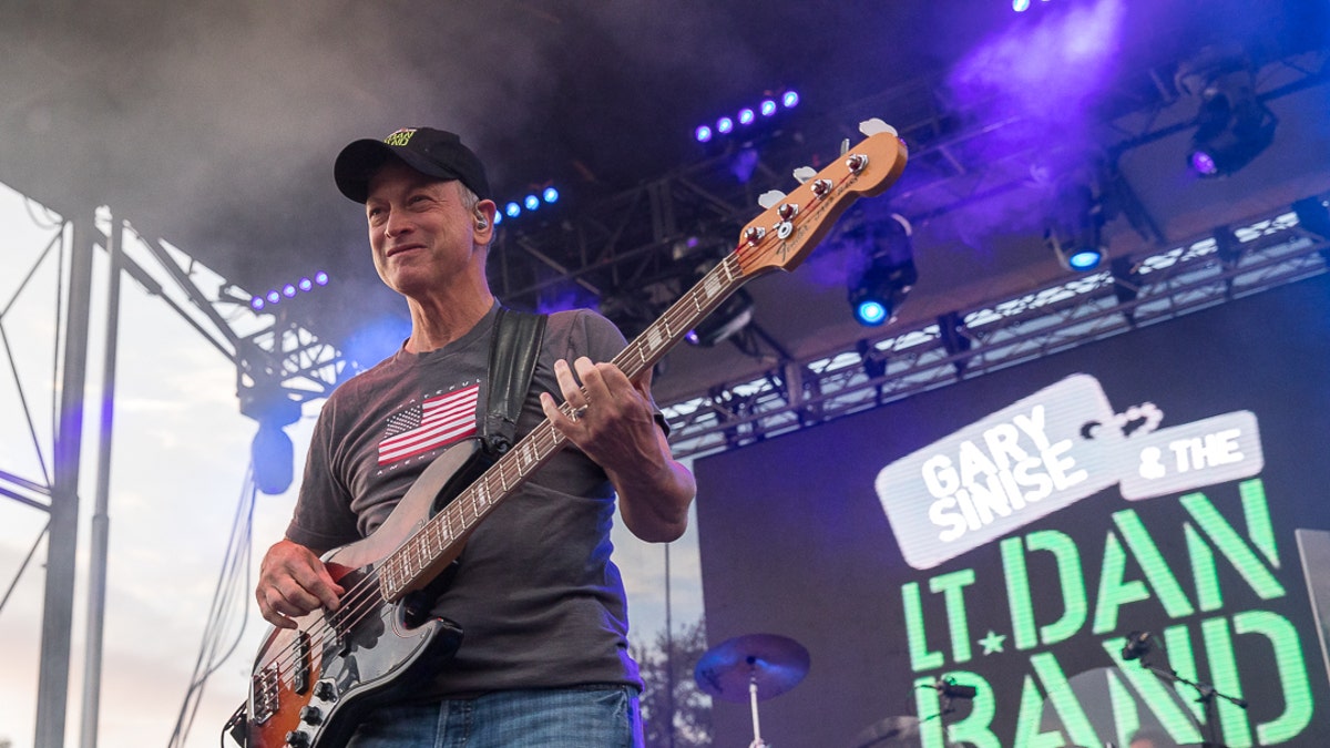 Gary Sinise plays the bass with his band