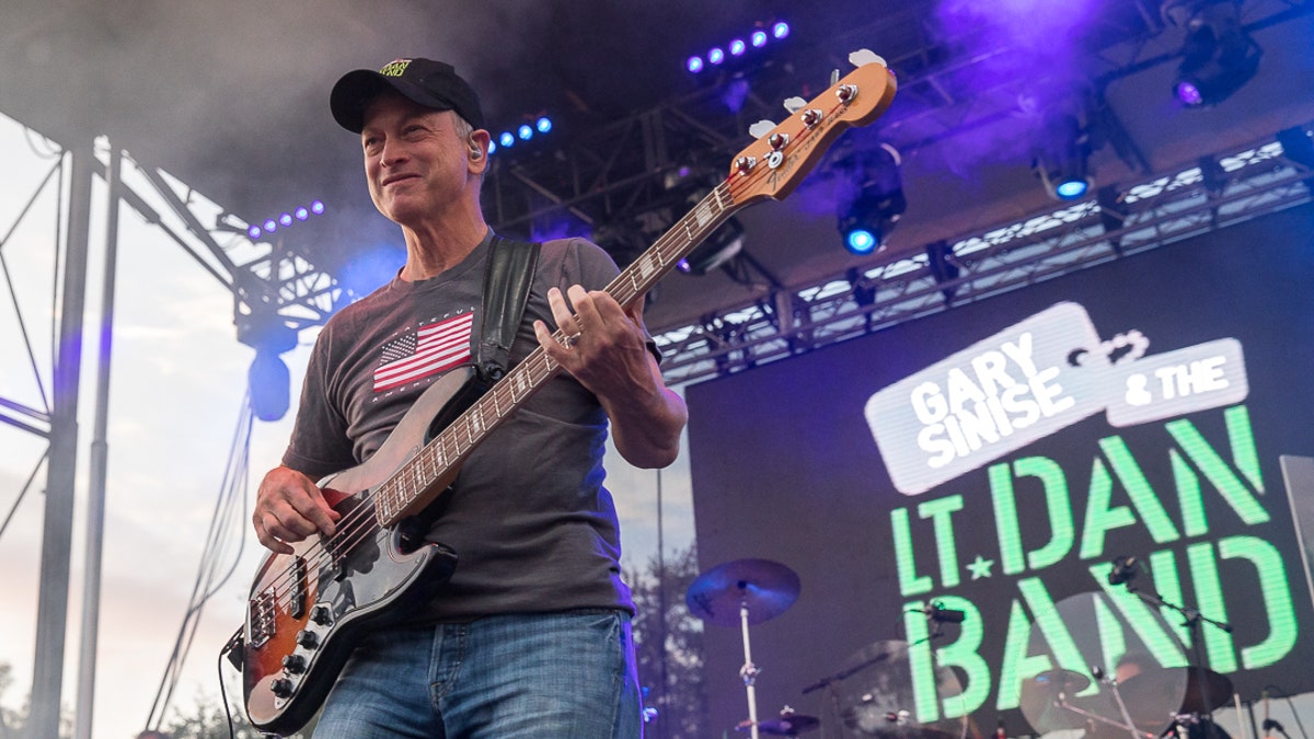 Gary Sinise plays the bass with his band