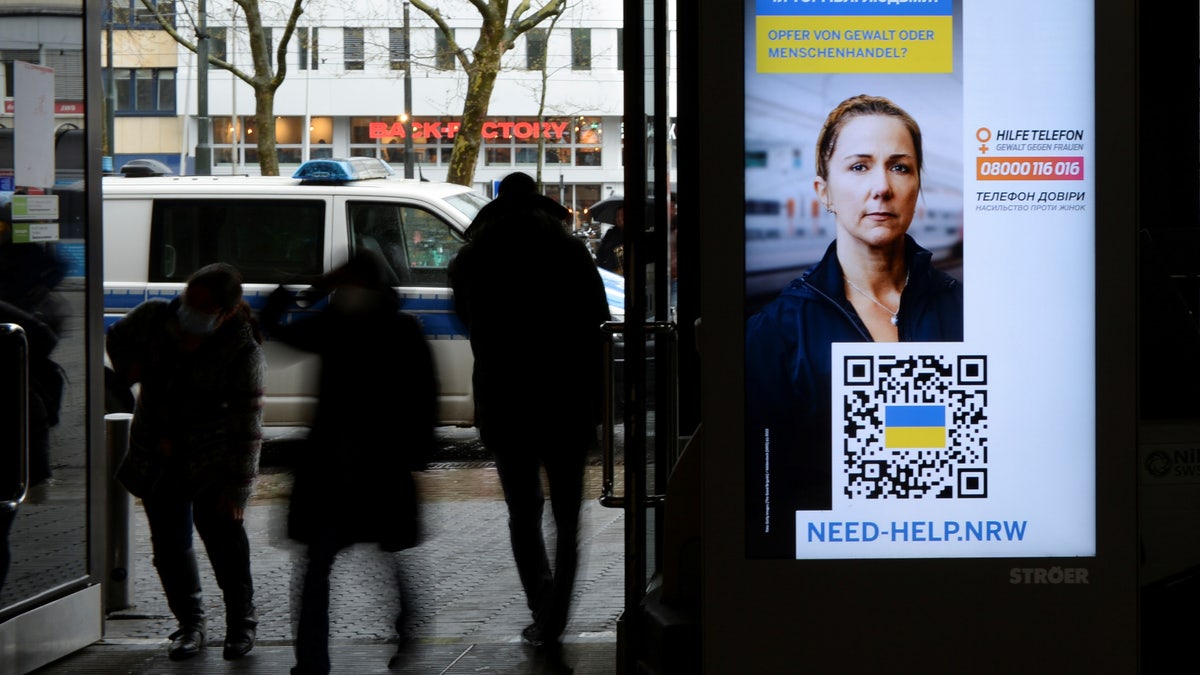 SIgns in Germany warn Ukrainian refugees about trafficking amid Russia's invasion