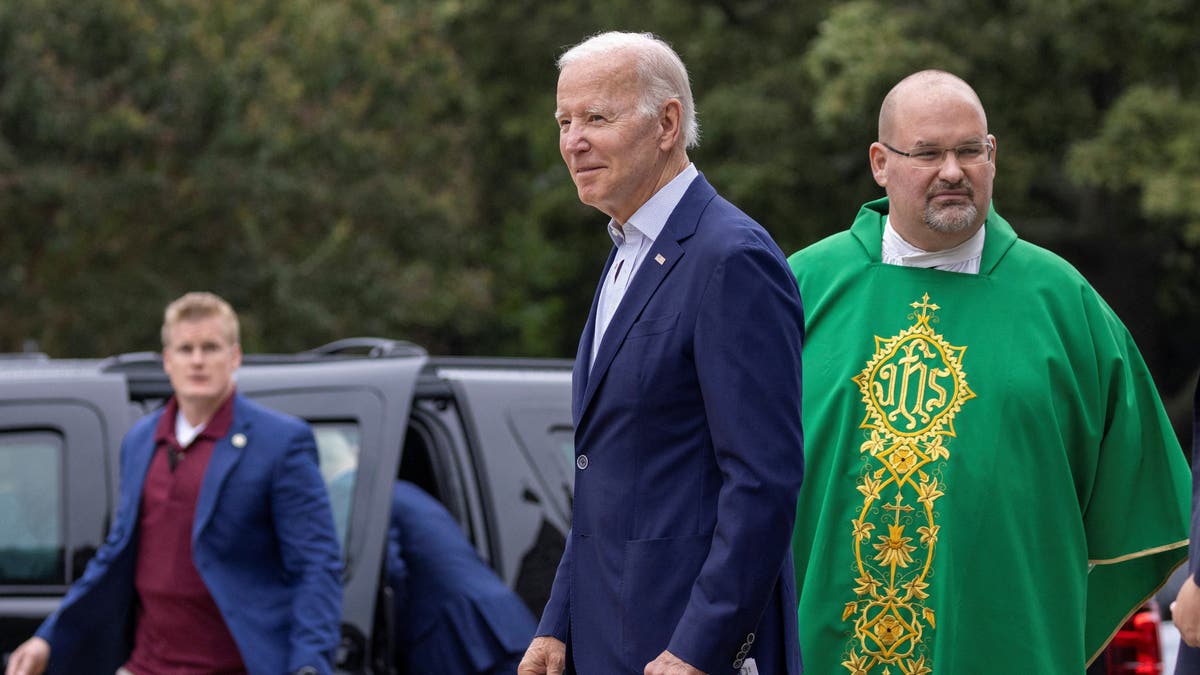 Joe Biden with Catholic priest