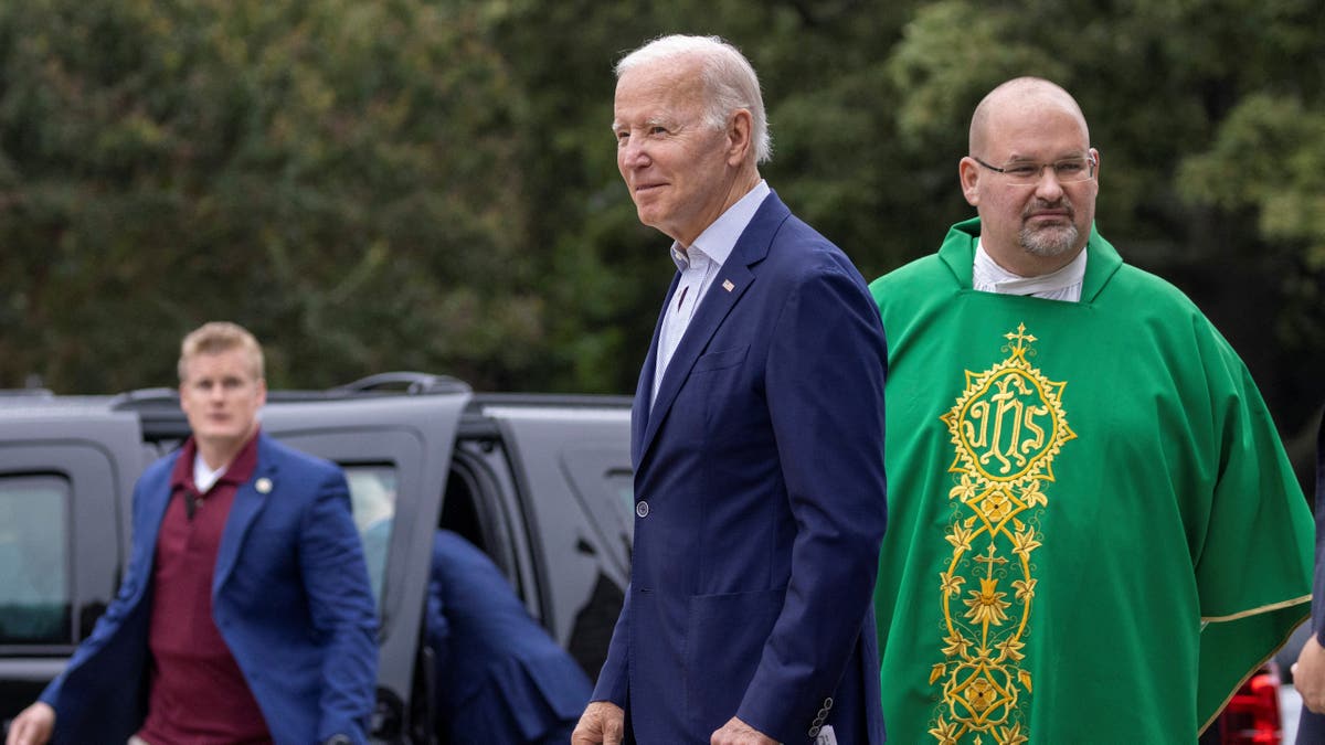 Joe Biden with Catholic priest