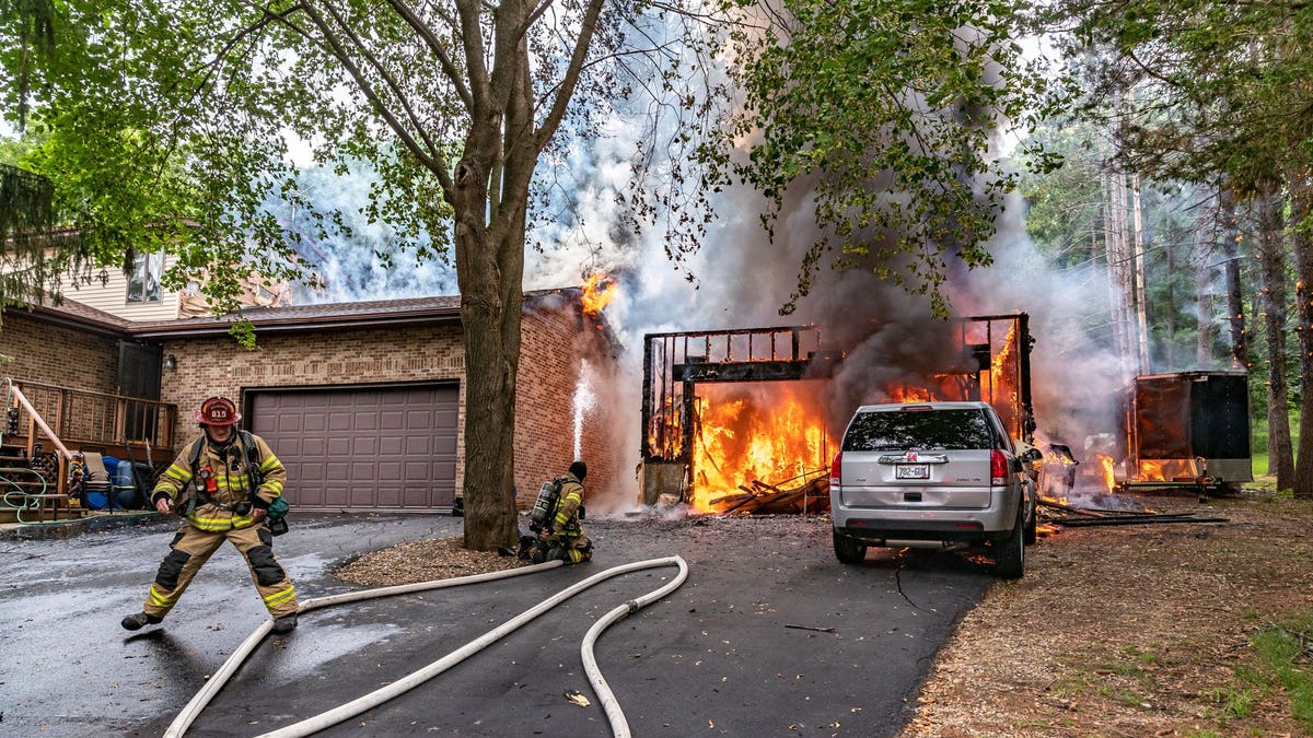 Janesville Fire Department firefighters respond to burning structure