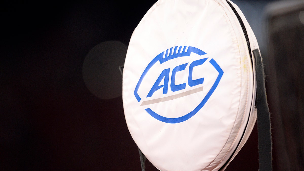 An ACC logo is seen on a yardage marker