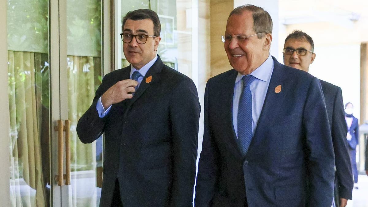 Russian Foreign Minister Sergey Lavrov walks with Brazil Foreign Minister Carlos Alberto Franca at the G20 in Indonesia